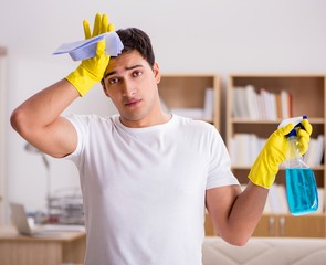 Man husband cleaning the house helping wife