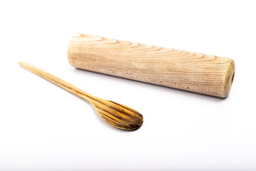 wooden spoon and rolling pin on white background