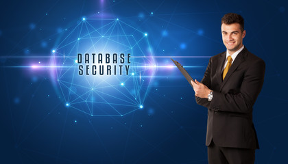 Businessman thinking about security solutions with DATABASE SECURITY inscription