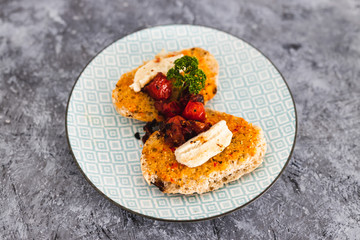 plant-based food, bruschetta with vegan mozzarella made of cashews and cherry tomatoes
