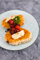 plant-based food, bruschetta with vegan mozzarella made of cashews and cherry tomatoes