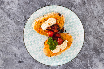 plant-based food, bruschetta with vegan mozzarella made of cashews and cherry tomatoes