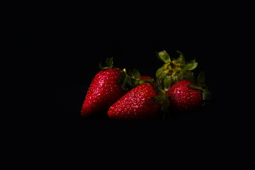 Some strawberry in a black background