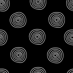 Vector seamless pattern of white hand-drawn circles isolated on a black background