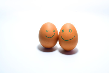 Smiling eggs on a white background