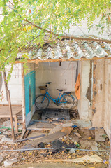 The inside of an abandoned house on a structure-only road. And there are old bikes that still work