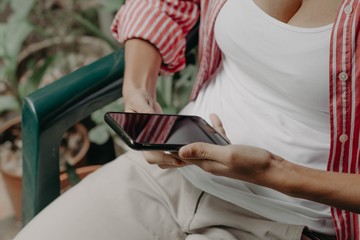 Hands holding a cellphone