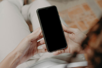 Hands holding a cellphone