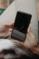 Hands holding a cellphone