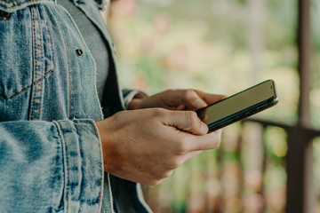 Hands with a black phone. smart phone