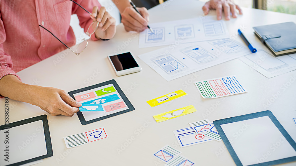 Wall mural creative web designer planning application and developing template layout, framework for mobile phon
