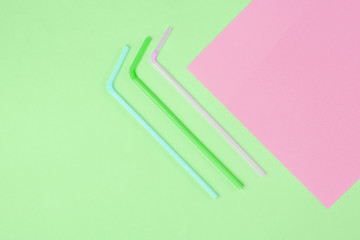 Cocktail tubes on a colored paper background. Minimalistic Cocktail Concept