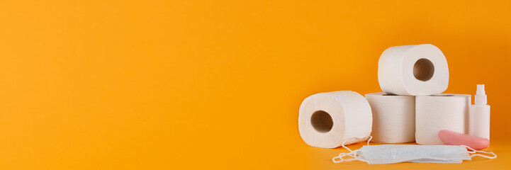 Toilet paper purchase due to kronavirus concept. Personal hygiene and stopping the spread of the virus. Cleanliness, Hygiene, Sterility. Banner.