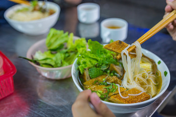 Vietnamese fried fish noodles served with vegetables- Bun Cha Ca 