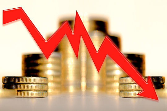 Red arrow on the background of money . Concept of the global financial crisis .
