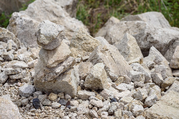 Folded pyramid of different stones in the mountains.