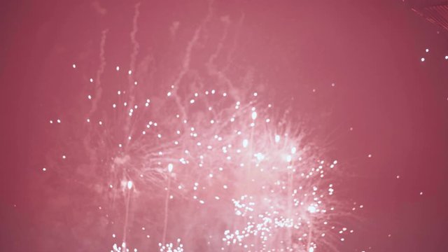 Heroic red and white image blur fireworks at summerfestival Tomorrowland in slow motion.