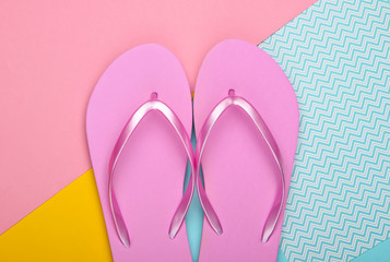 Flip flops on colored pastel background. Top view