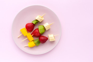 Healthy assorted fruit skewers from above