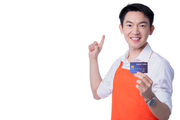 young smart attractive asian male reatuarant owner hand sign ok with credit card online purchase order online from home concept asian apron uniform smile warmw welcome for appllication order isolate