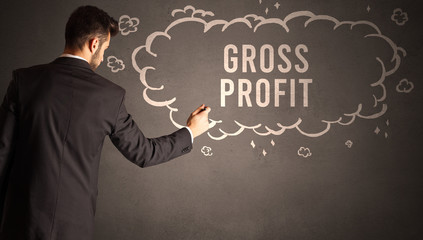 businessman drawing a cloud with GROSS PROFIT inscription inside, modern business concept
