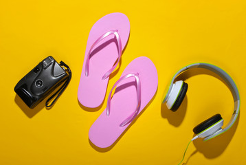 Summer vacation concept, travel. Beach accessories and stuff on a yellow background. Studio shot. Flat lay