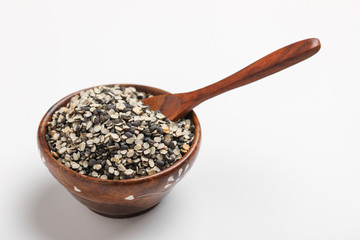 Split Black Lentil Also Know as Black Gram, Black Urad Dal, Vigna Mungo, Urad Bean in wooden bowl on white background