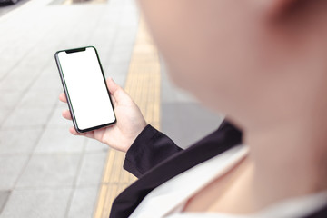 Business woman hand holding phone isolated on screen display check stock exchange in market 