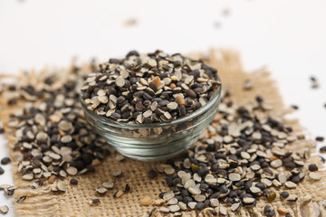 Split Black Lentil Also Know as Black Gram, Black Urad Dal, Vigna Mungo, Urad Beani glass bowl on white background