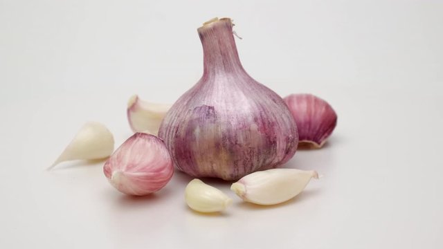 Head garlic 360 rotation. Shot on a white background.