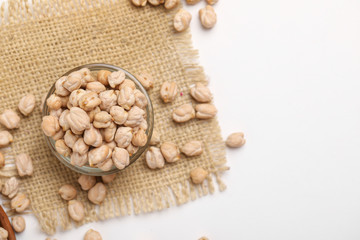 Uncooked dried chickpeas in glass bowl