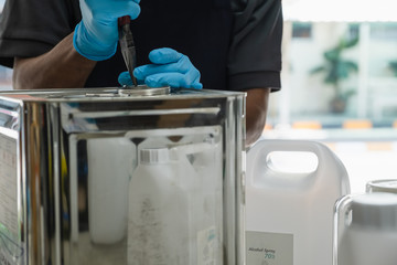 The scientists inject chemicals into plastic tubes,Scientist mix alcohol 75% Hand wash gel Kill the disease Covid 19 In the laboratory prepare sample for test Produce 75% alcohol