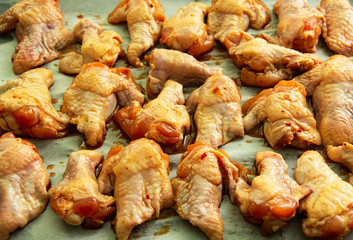 Raw chicken wings with soy sauce