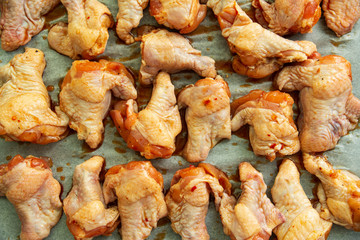 Raw chicken wings with soy sauce