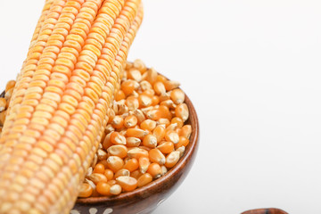 Dried corn seed on white background. Grains of ripe corn.