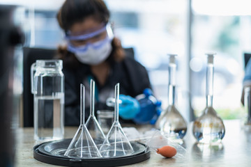 The scientists inject chemicals into plastic tubes,Scientist mix alcohol 75% Hand wash gel Kill the disease Covid 19 In the laboratory prepare sample for test Produce 75% alcohol