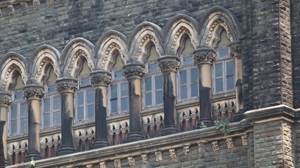 Naklejka premium Mumbai, Maharastra/India- March 25 2020: Windows of an old gothic structure of the victorian era.