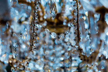 An abstract image of a retro glass chandelier with blurred foreground and background