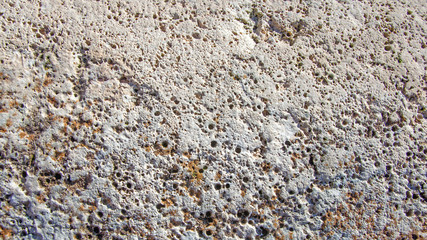 Old stone porous wall background