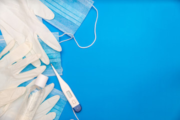 top view image of medical supplies to prevent infection on classic blue background