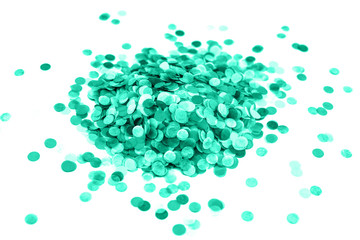 Heap of mint confetti isolated on white.