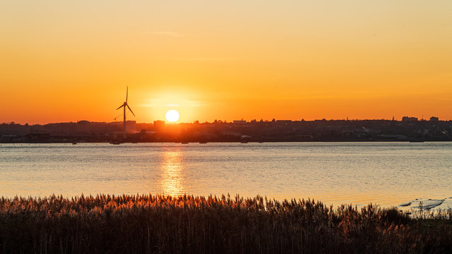 Sun setting over Slade Green near dartford along the Thames Estuary, Kent England