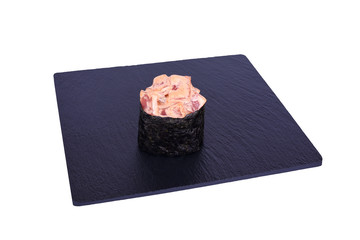Traditional fresh japanese sushi on black stone Gunkan spicy teka on a white background. Gunkan ingredients: tuna, spicy sauce, nori, rice.