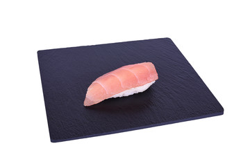Traditional fresh japanese sushi on black stone Nigiri teka on a white background. Gunkan ingredients: tuna, rice.