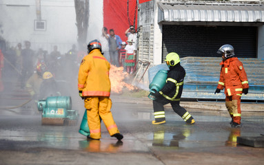 Firefighters using extinguisher