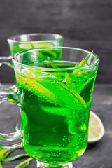 Lemonade Tarragon in two goblets on dark board