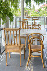 Brown chair And dining table in a bakery outside the building with natural