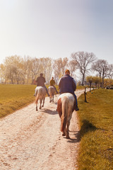 Horse riders on the country side during Autumn