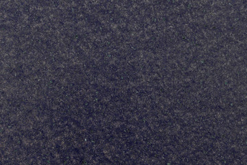 Marble granite tiles. Spotted structure. The color is blue. It is applied in modern design, for example in hospitals or shopping centers. Horizontal view. Close-up. Copy space.