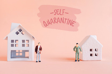 Self quarantine concept, miniature people stay home and work from home during the outbreak of the COVID-19 and Coronavirus, self isolation to prevent the spread the pandemic